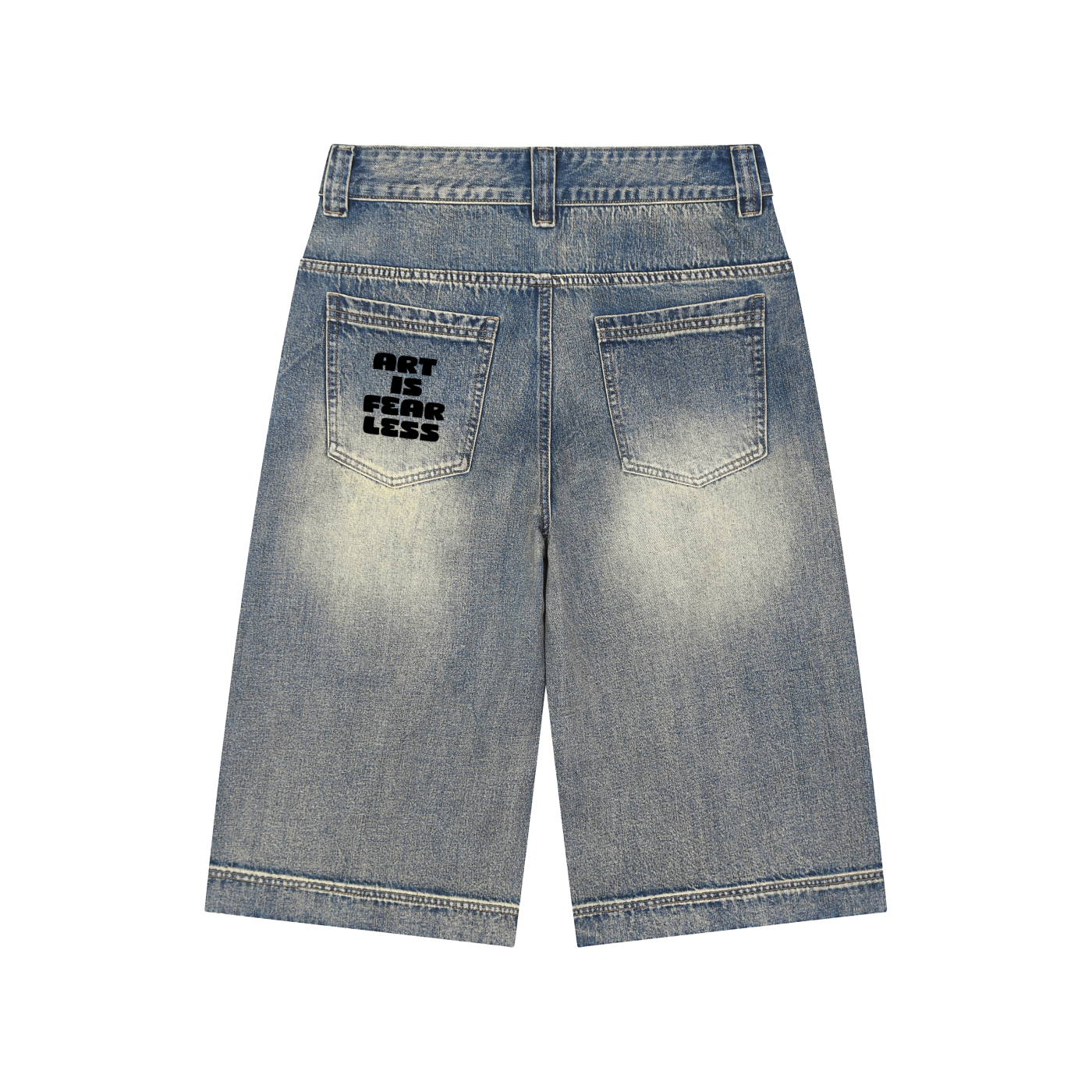 Back view of light-wash denim shorts with a black graphic print on the left back pocket reading 'ART IS FEAR LESS', shown on a plain white background.
