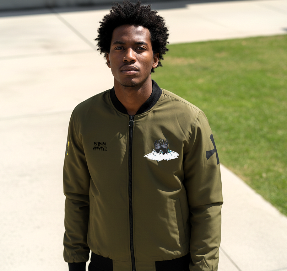 Man wearing a green bomber jacket with logos on a sidewalk