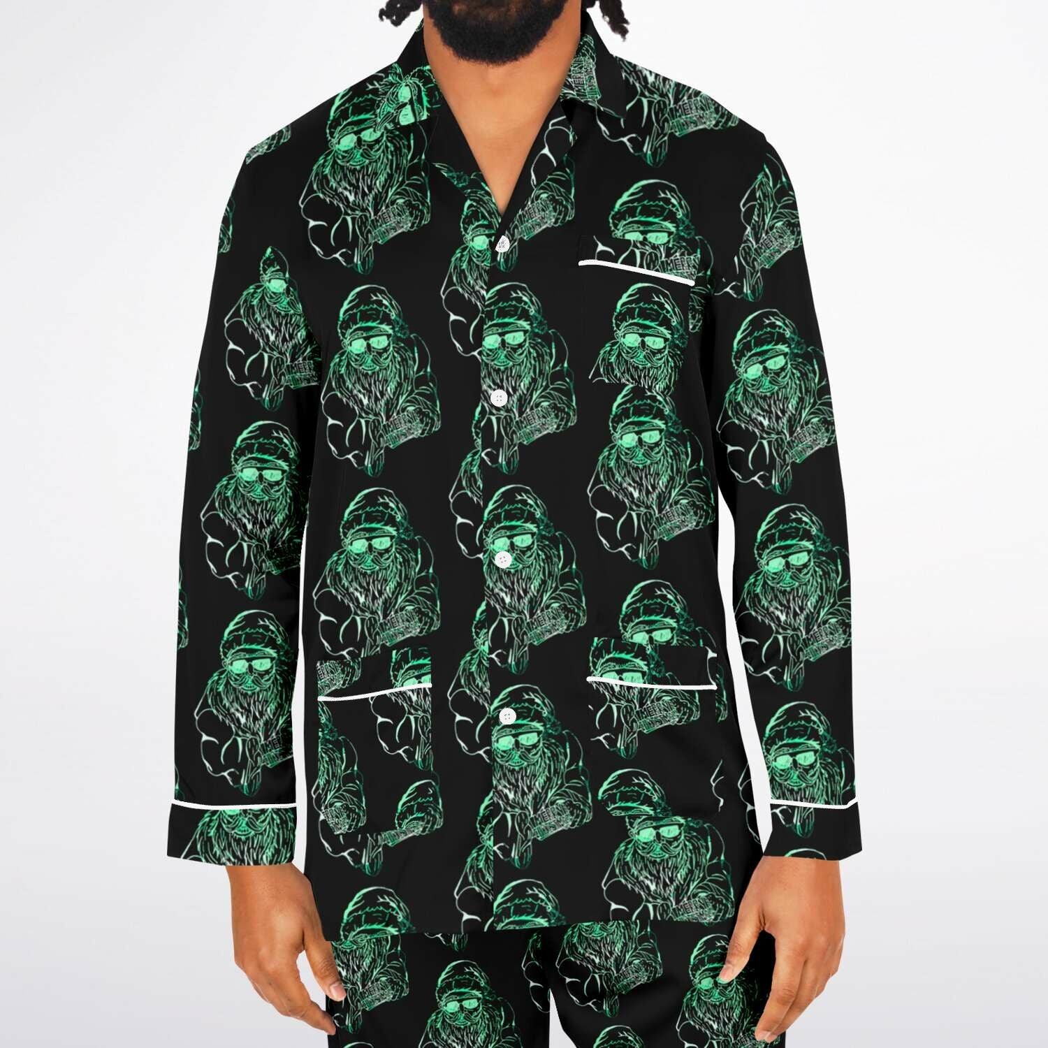 Black shirt with green graphic pattern worn by a person on a white background