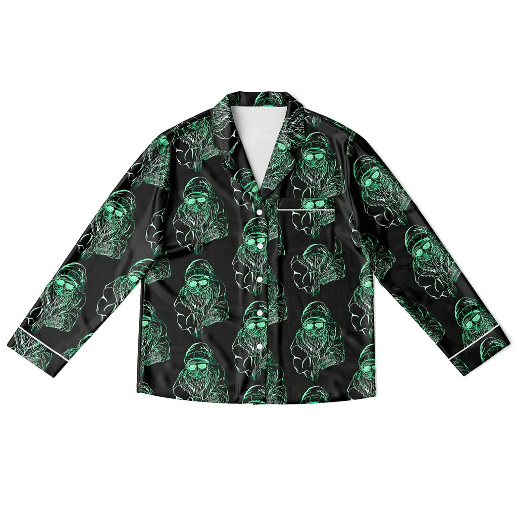 Black shirt with green alien pattern on a white background