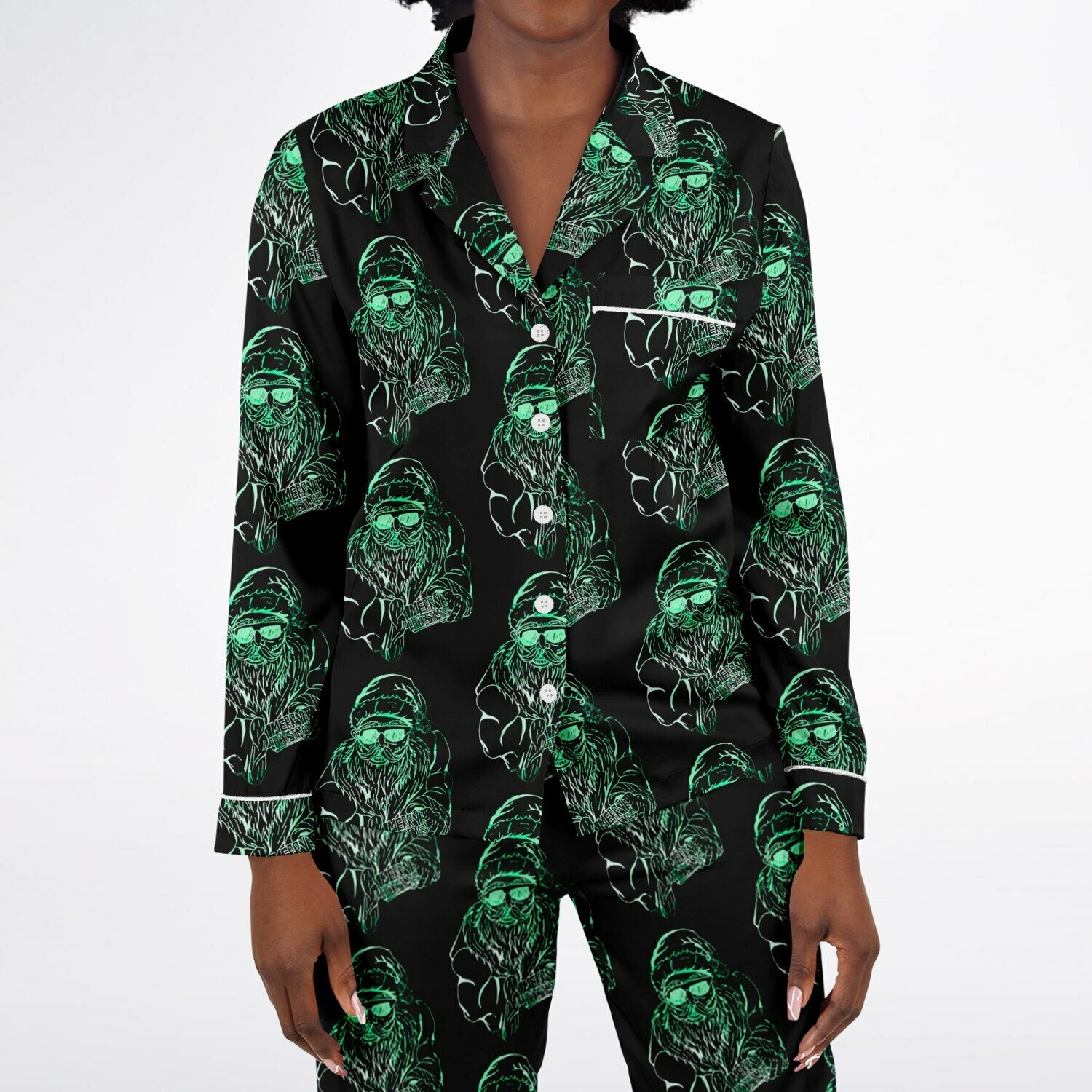 Black pajama set with green ghost pattern on a white background