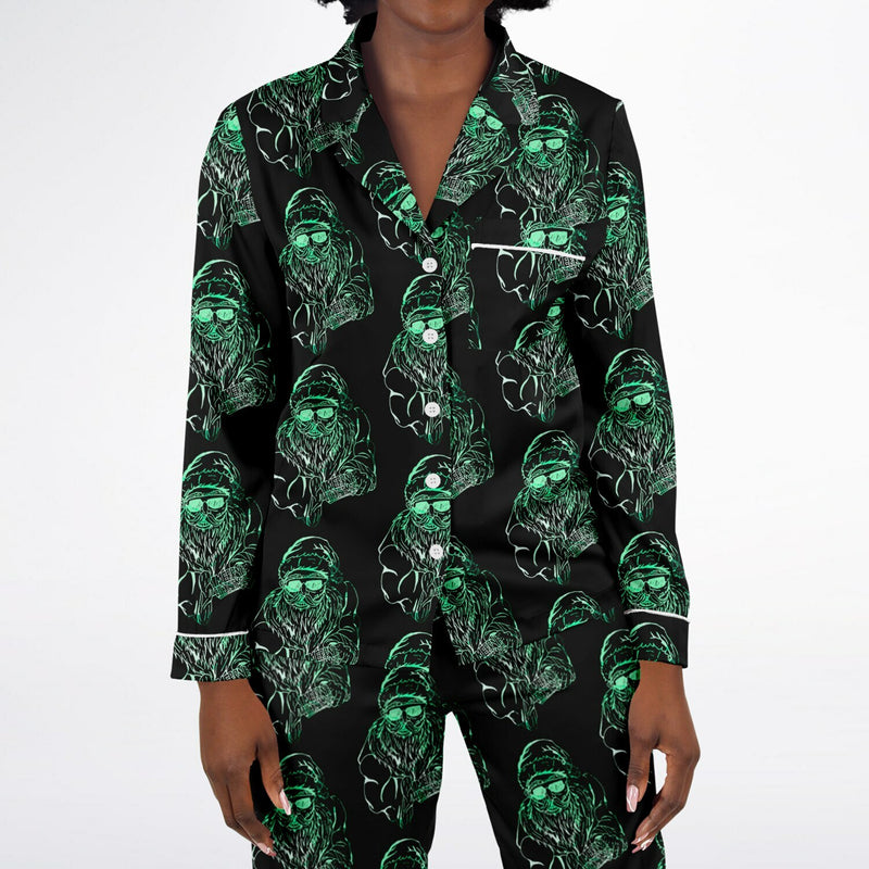 Black pajama set with green ghost pattern on a white background