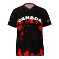 Black t-shirt with red splatter design and 'Canada' text on a white background
