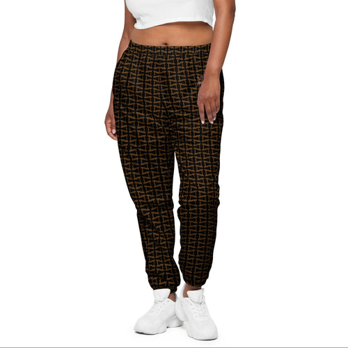 Woman wearing a white crop top and patterned pants on a white background