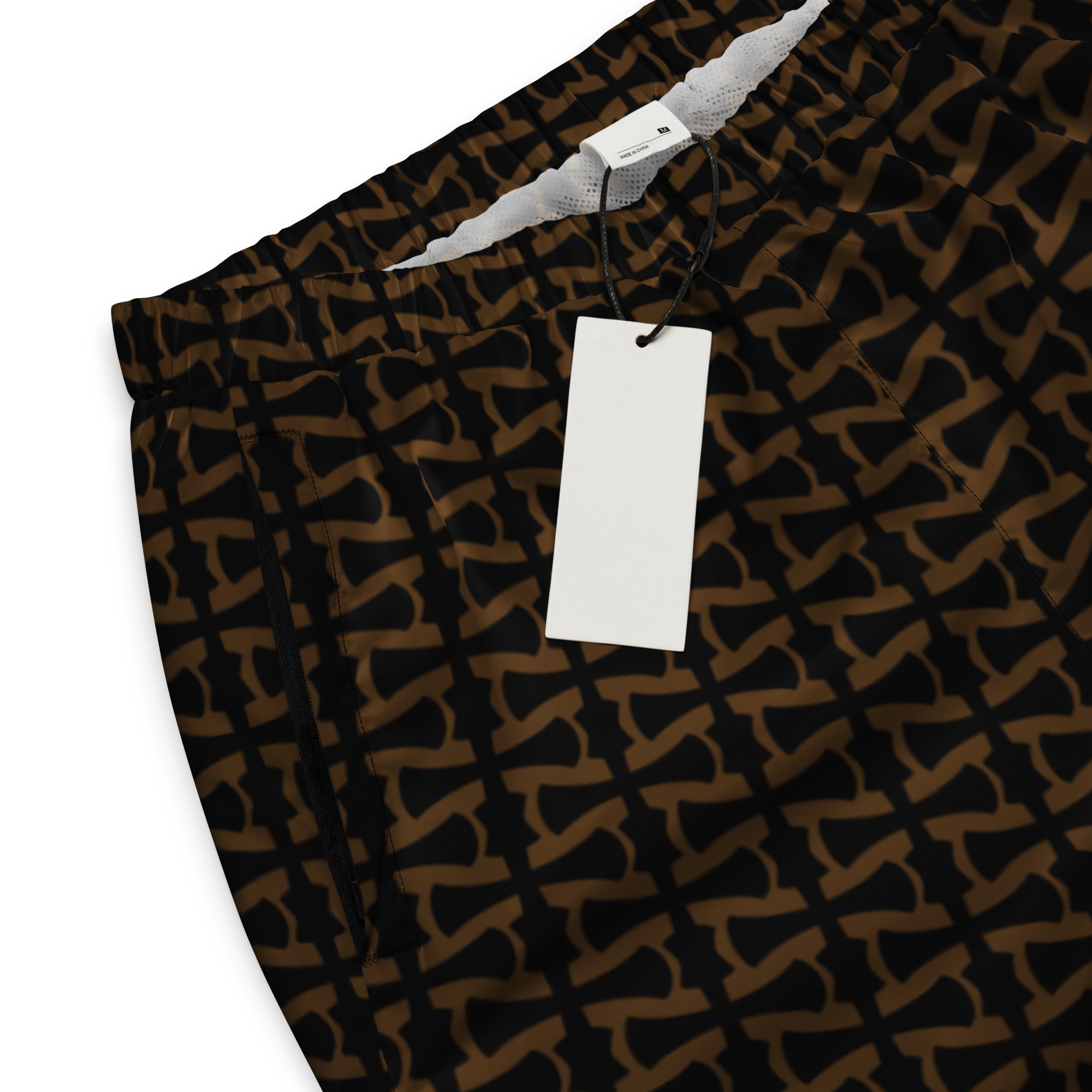 Patterned pants with a white tag on a white background