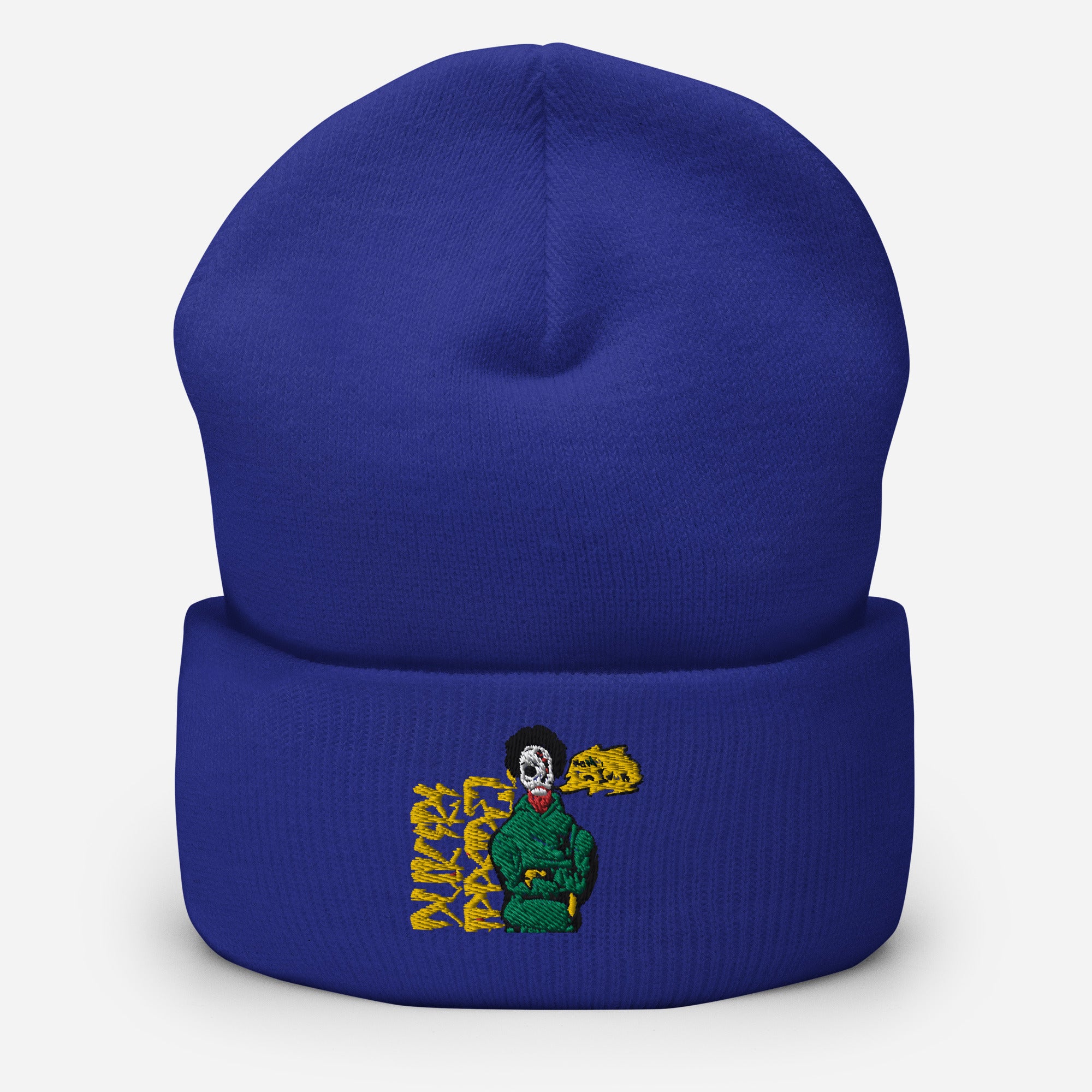 Royal blue beanie hat with embroidered graphic of a character in green, featuring artistic yellow text.