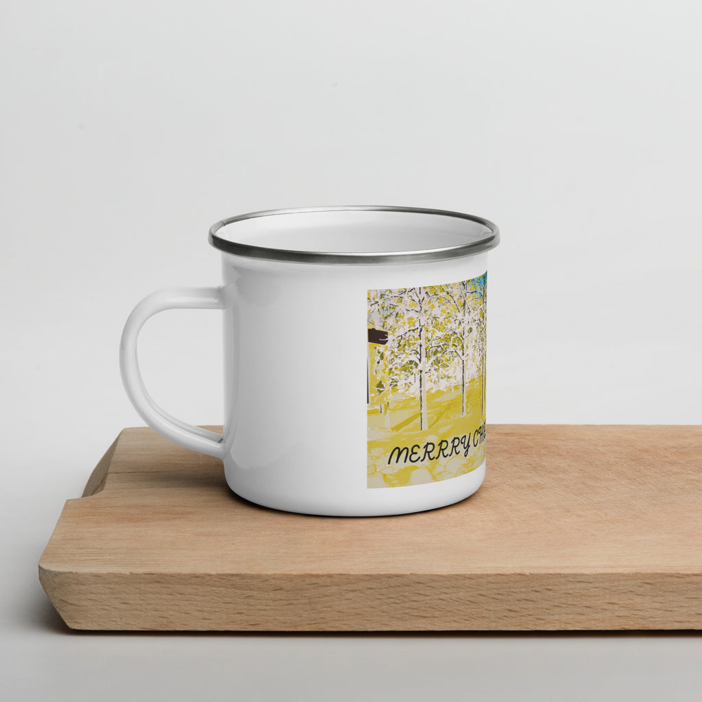 White enamel mug with a colorful design on a wooden surface