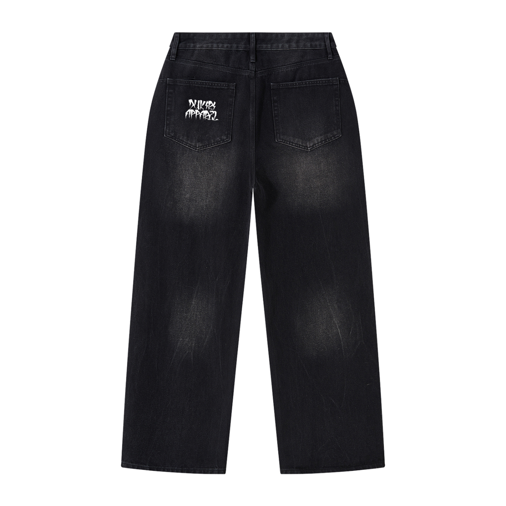 Black washed denim jeans shown from the back, featuring a white embroidered graphic on the right pocket that reads 'MURDER ANYSPY'.