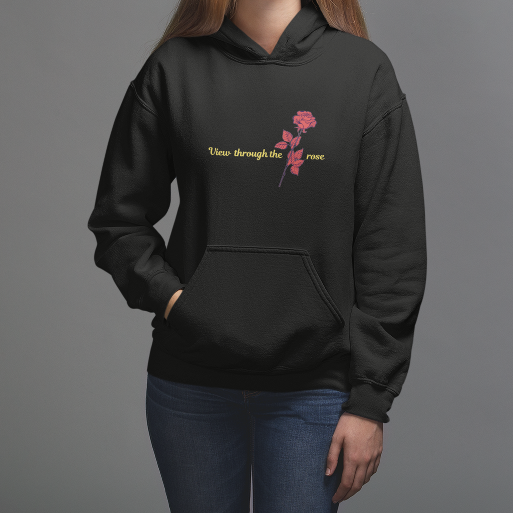 a woman wearing a black hoodie with pink flowers on it